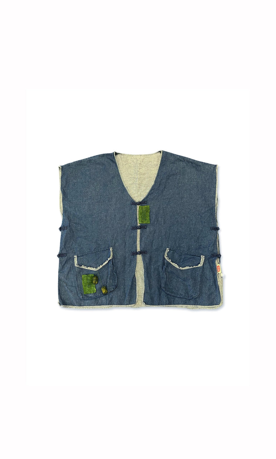 Plümo- Suzu Denim Gilet: sleeveless, boxy fit with frayed edges, two front pockets, and green patches above and on left pocket.