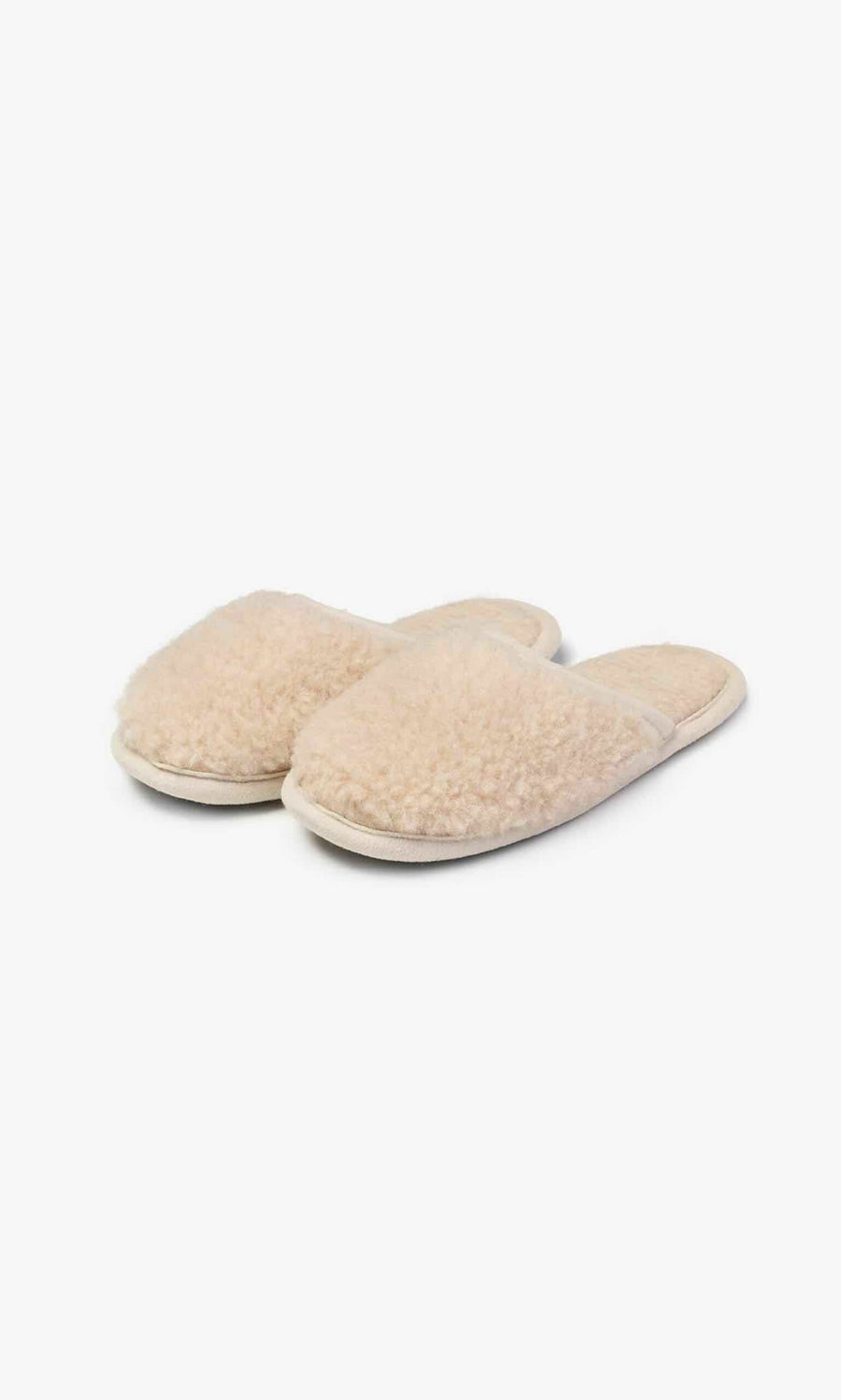 Plümo- Jovi Slippers: beige fuzzy merino wool, open backs, felt sole, shown on a white background.