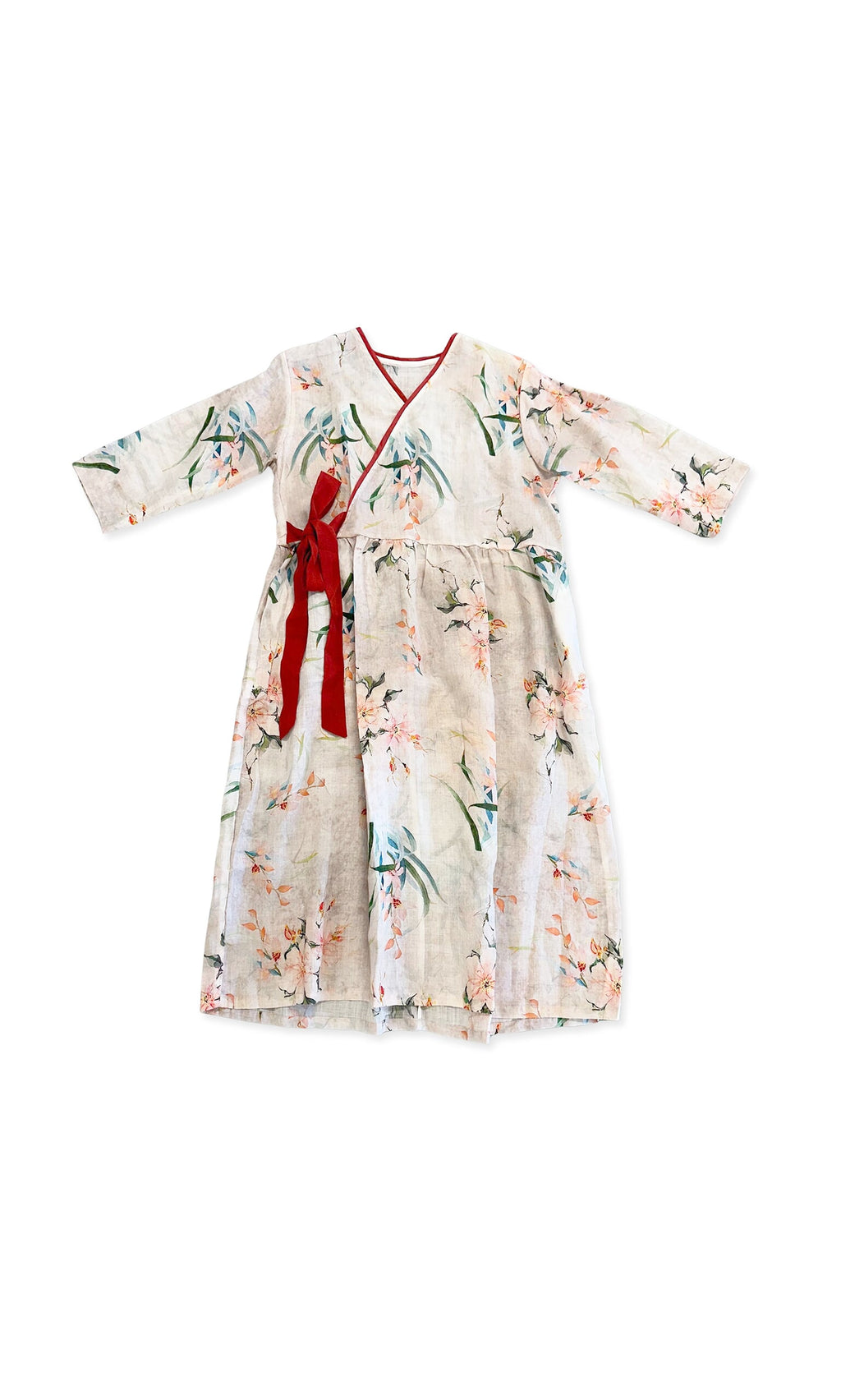 Plümo- Lian Flower Dress: light pink floral wrap, long sleeves, red trim neckline, tie waist on white background.
