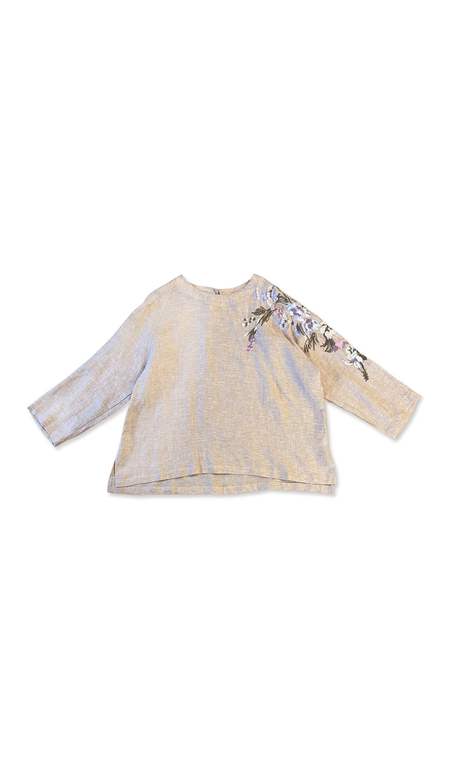 Plümo- Reina Top: Beige linen, long sleeves, floral embroidery on right shoulder, shown flat on a white background.