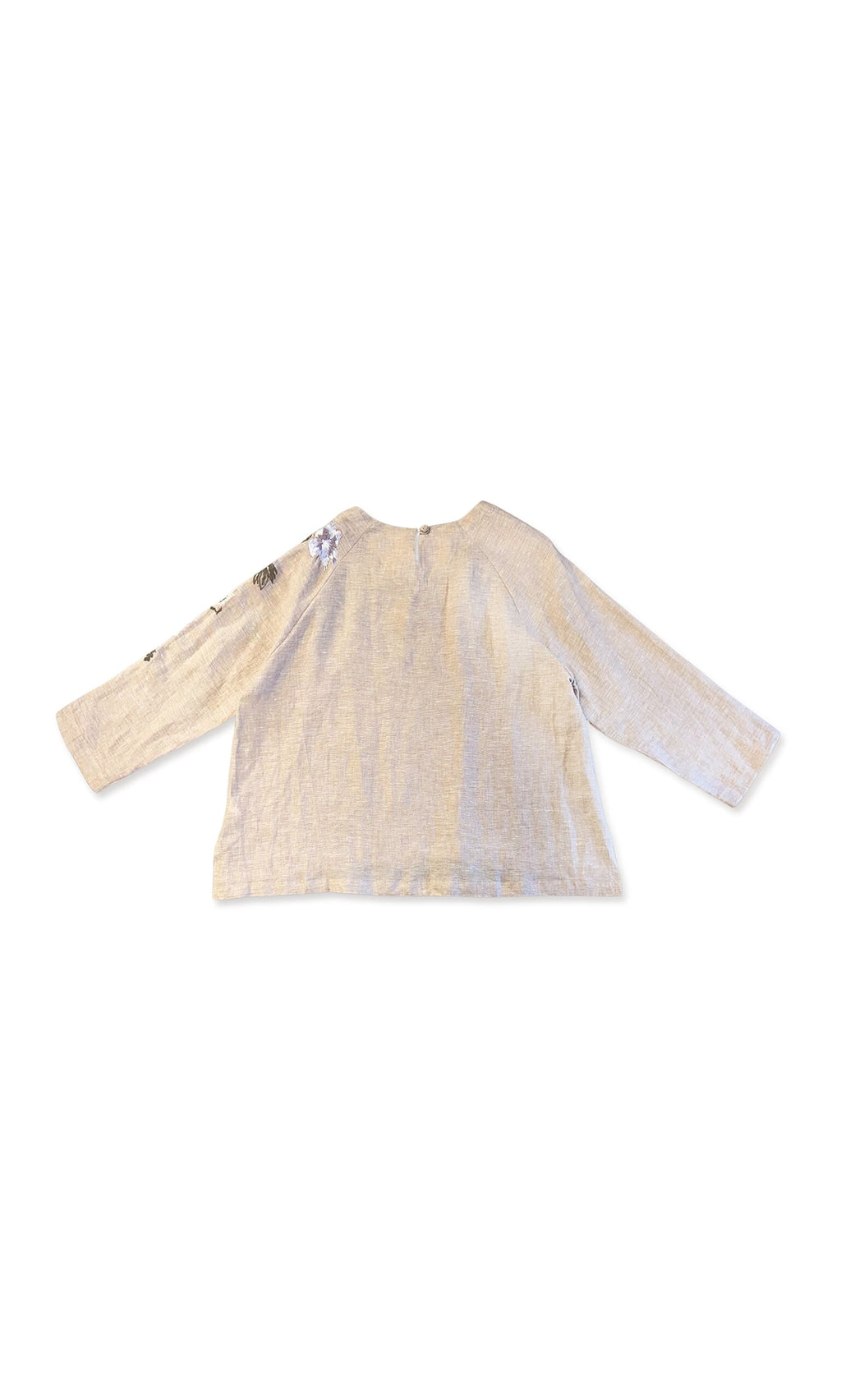 Plümo- Reina Top in beige linen with floral embroidery on one long sleeve, shown flat with back facing up.