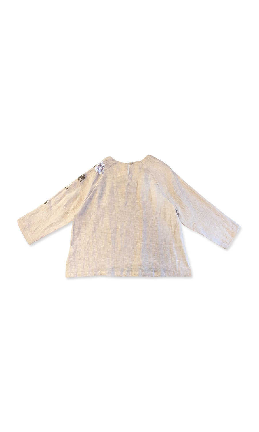 Plümo- Reina Top in beige linen with floral embroidery on one long sleeve, shown flat with back facing up.
