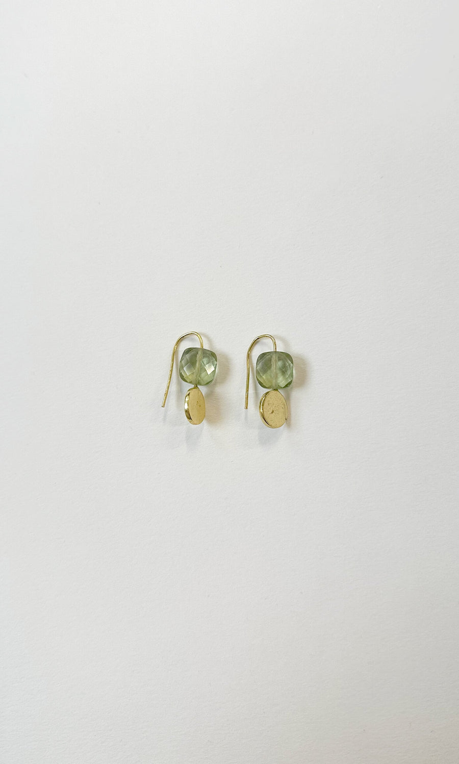 Plümo- Ariel Drop Earrings: lightweight green beads with gold drop charms on simple hooks, shown on a white background.