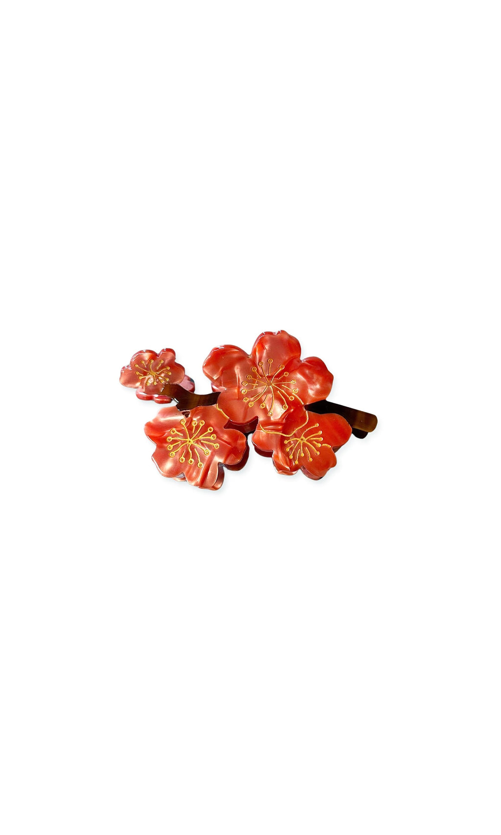 Plümo- Three coral Cherry Blossom Clips with yellow centers, inspired by flower hair claws, on a white background.