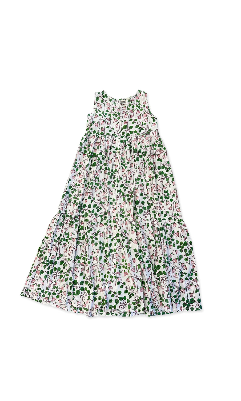Plümo- The Connie Dress is a sleeveless, long white dress with colorful hand-printed floral and leaf patterns.