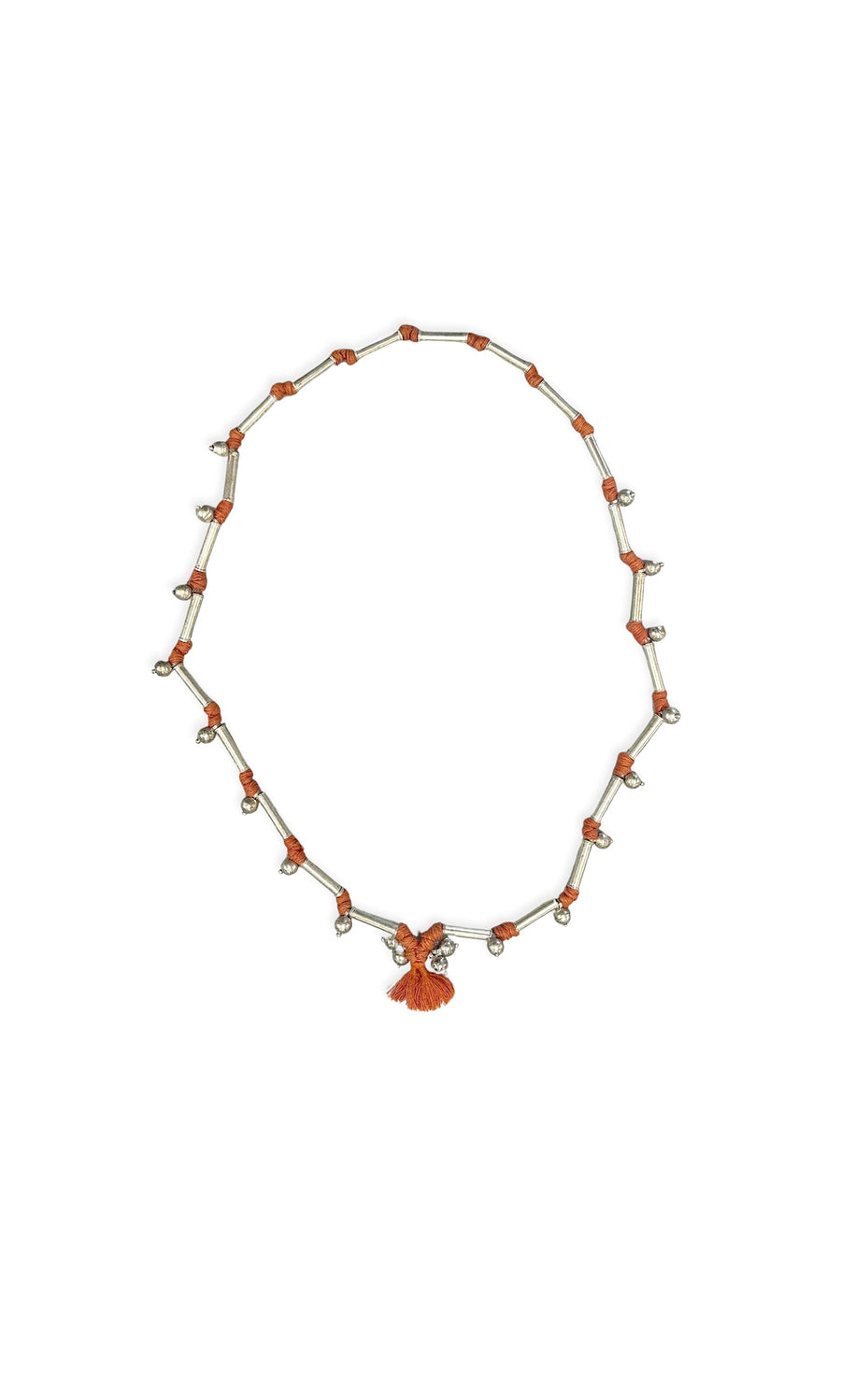 Plümo- Corrin Necklace: Orange and silver layered necklace with small charms and a central orange tassel pendant.