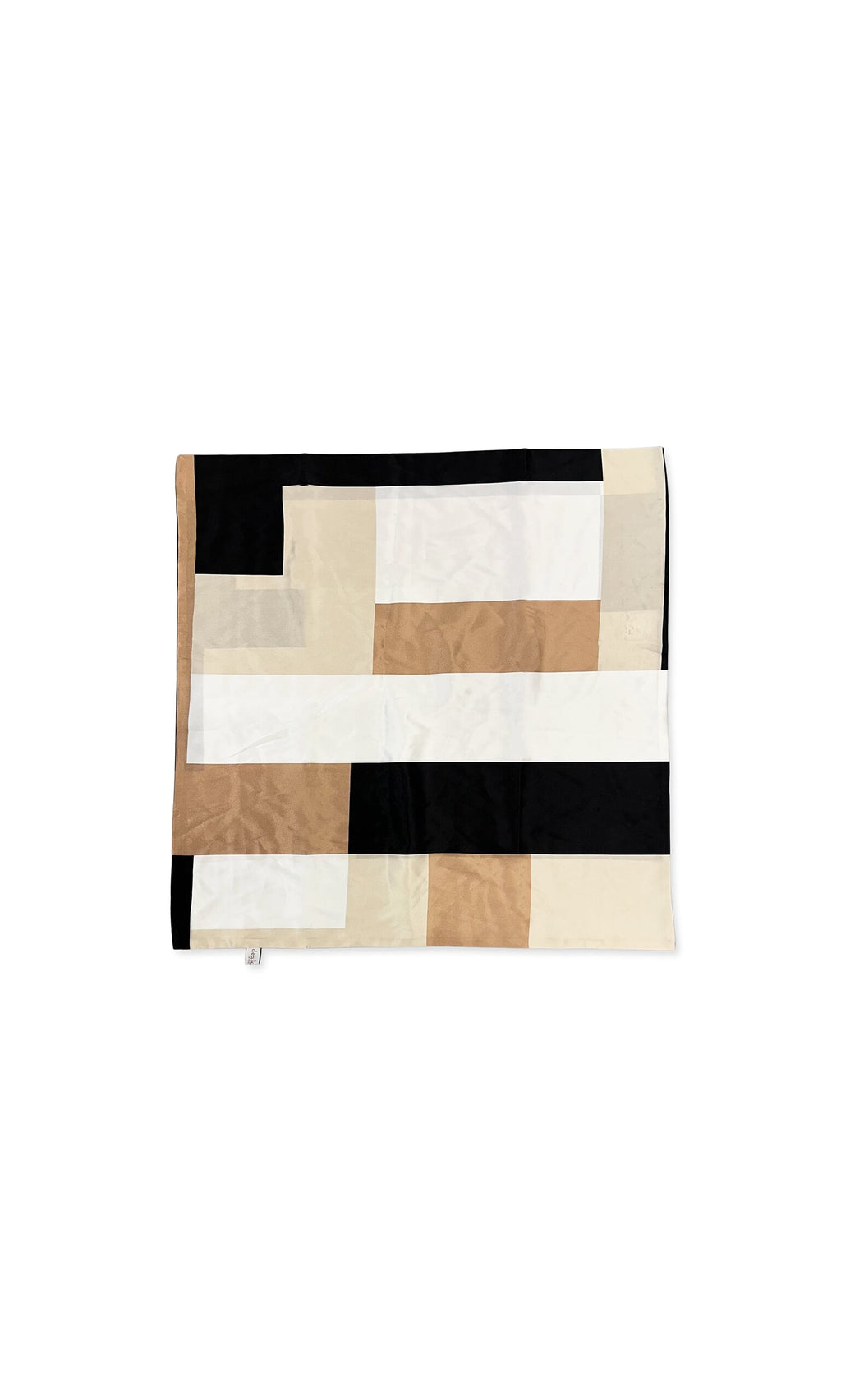 Plümo- The Dea Neck Scarf features a geometric pattern in black, beige, white, and tan on a crisp white background.