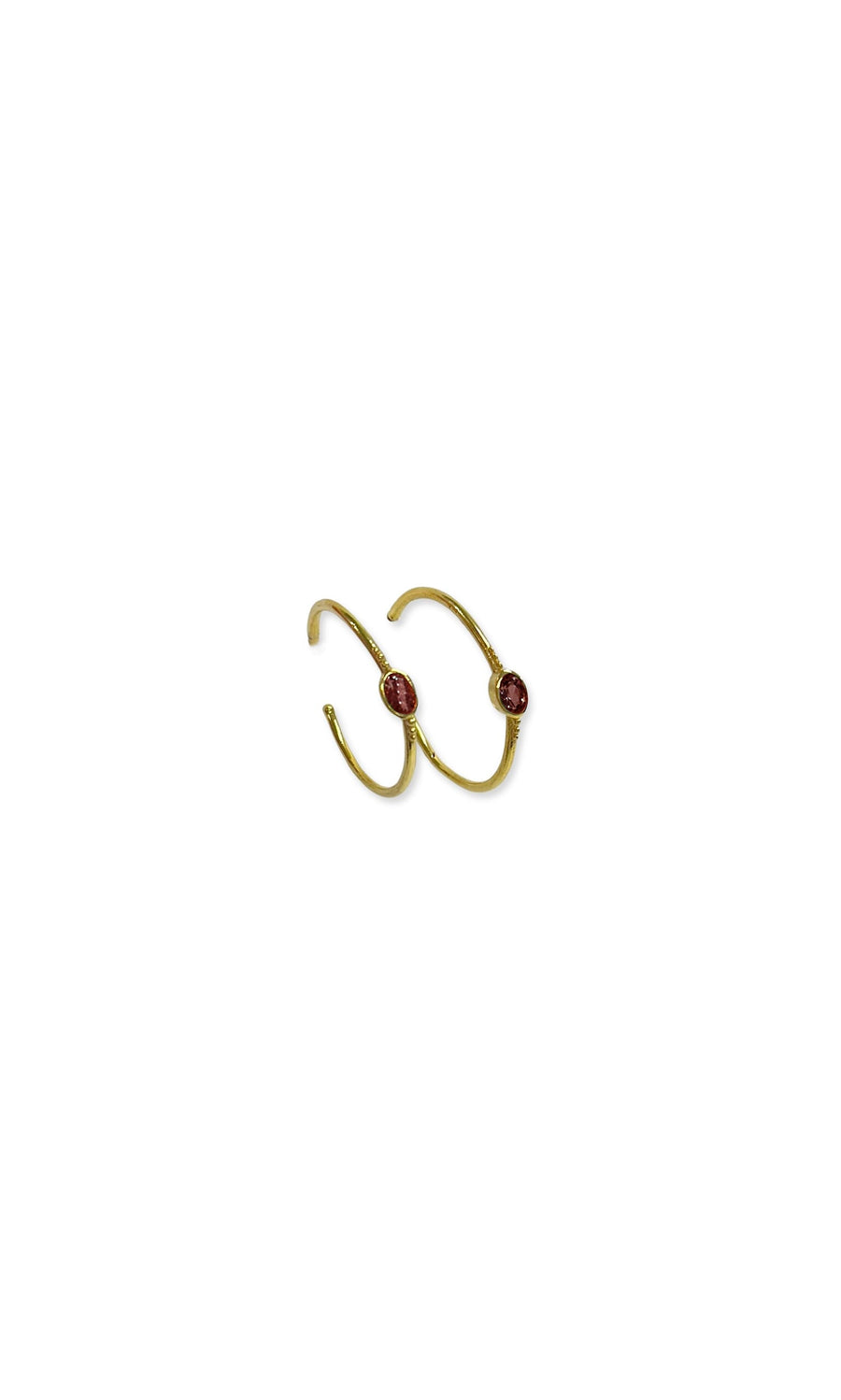 Plümo- Garnet Hoops: Gold hoop earrings each feature a small round red garnet on the front.