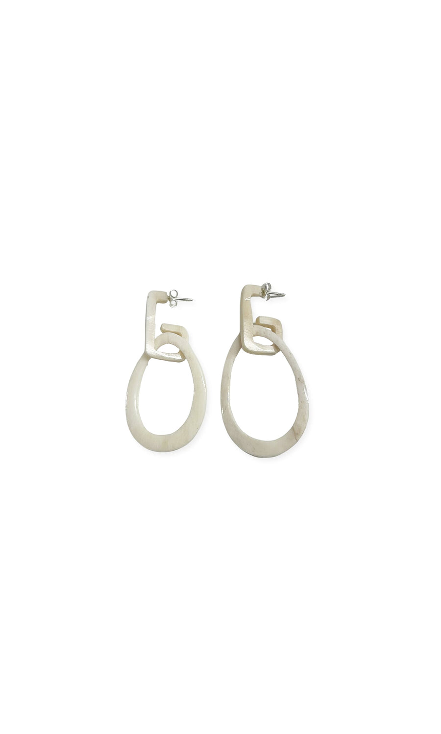 Plümo- Geometric Earrings: Abstract, off-white horn earrings with irregular shapes, shown on a white background.