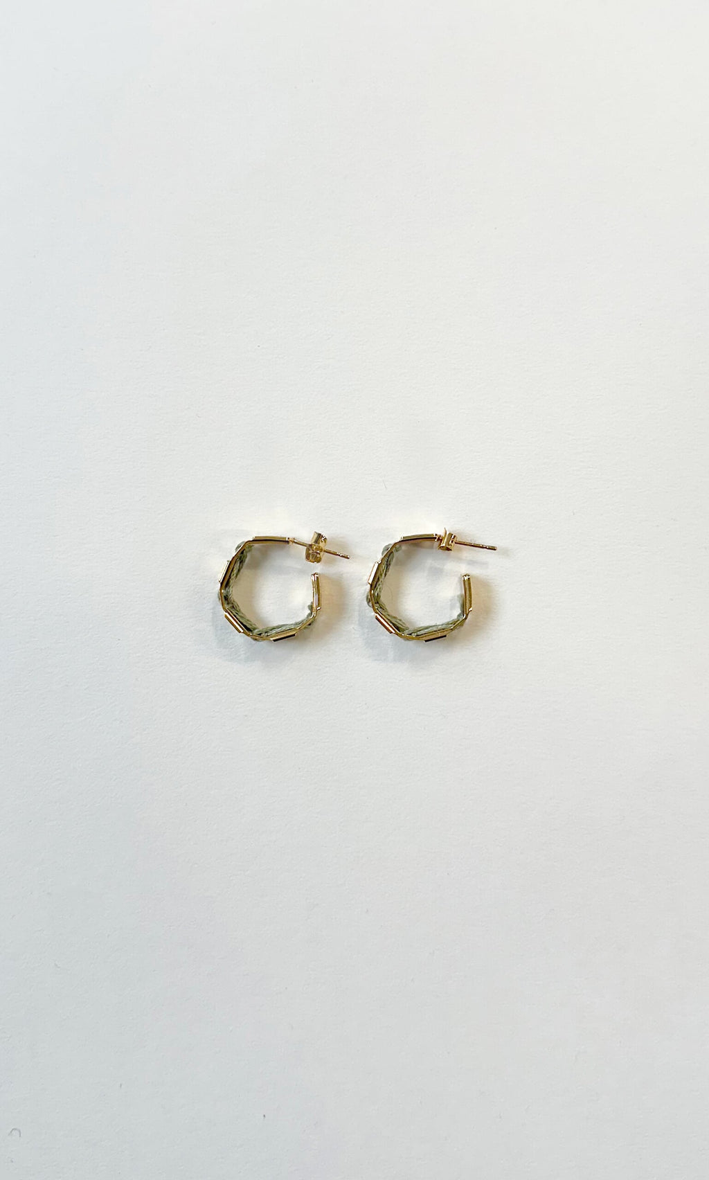 Plümo- Ivana Hoops: small handcrafted gold hoop earrings with a hexagonal geometric design on a plain white background.
