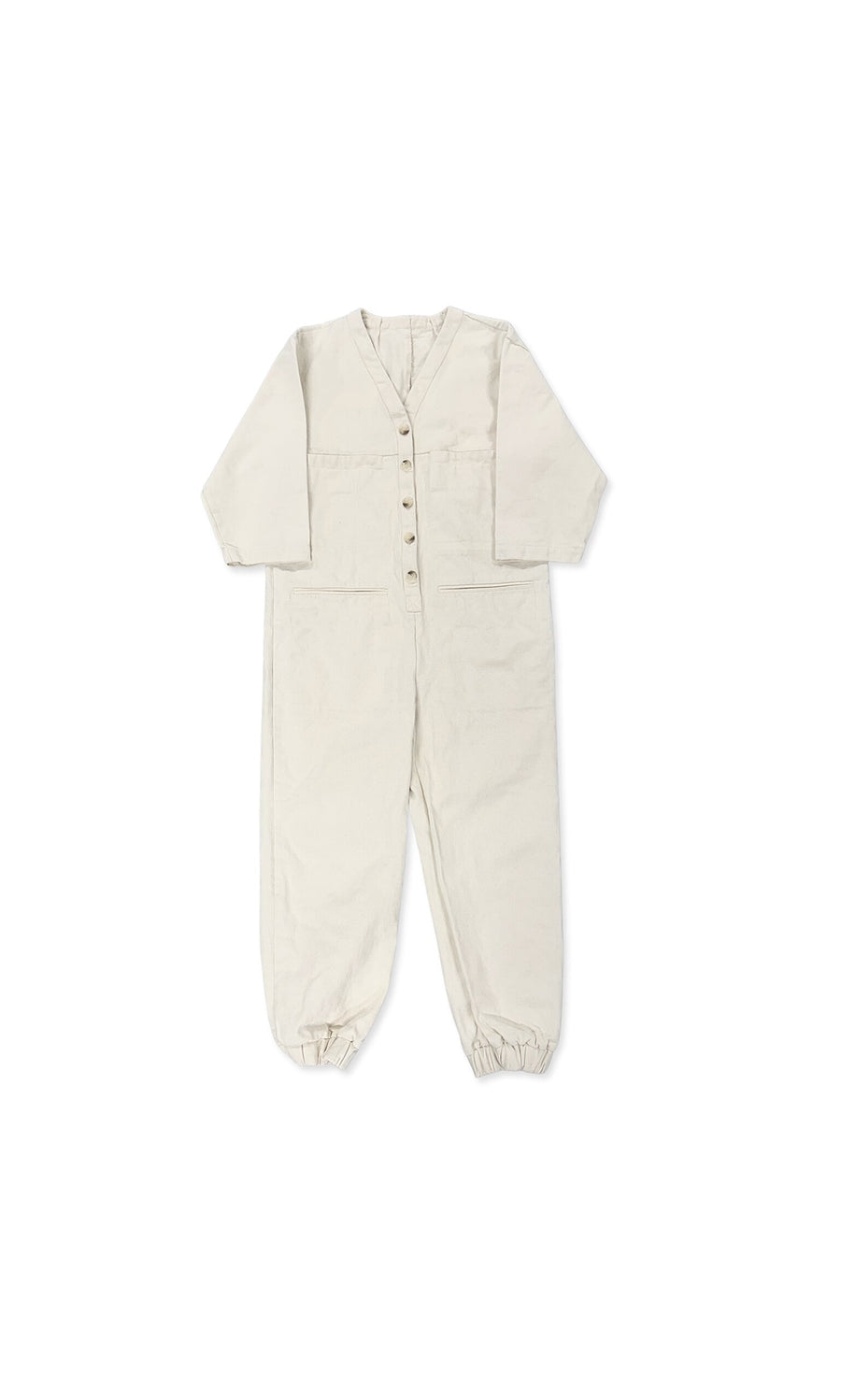Plümo- The Jodie Jumpsuit is a beige, long-sleeve kids' boiler suit with front buttons and elastic ankle cuffs.