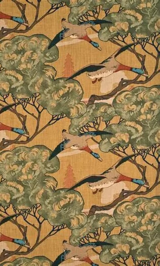Plümo- Blue and brown flying ducks in green trees on a yellow 'Flying Ducks' fabric by Mulberry.