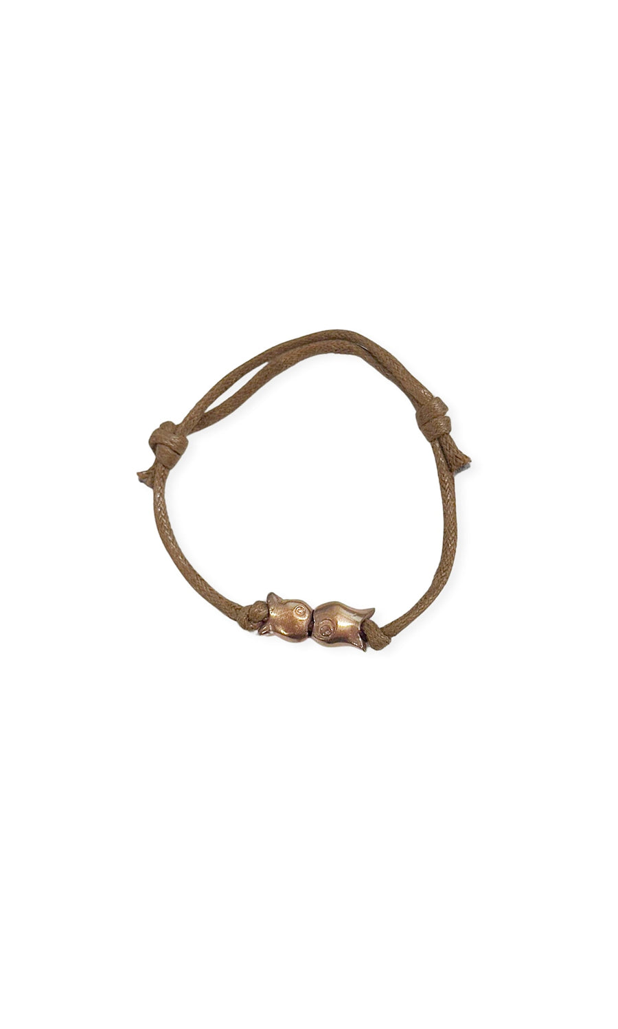 Plümo- Naselli Bracelet: Brown adjustable cord with two bronze fish beads facing each other at the center.
