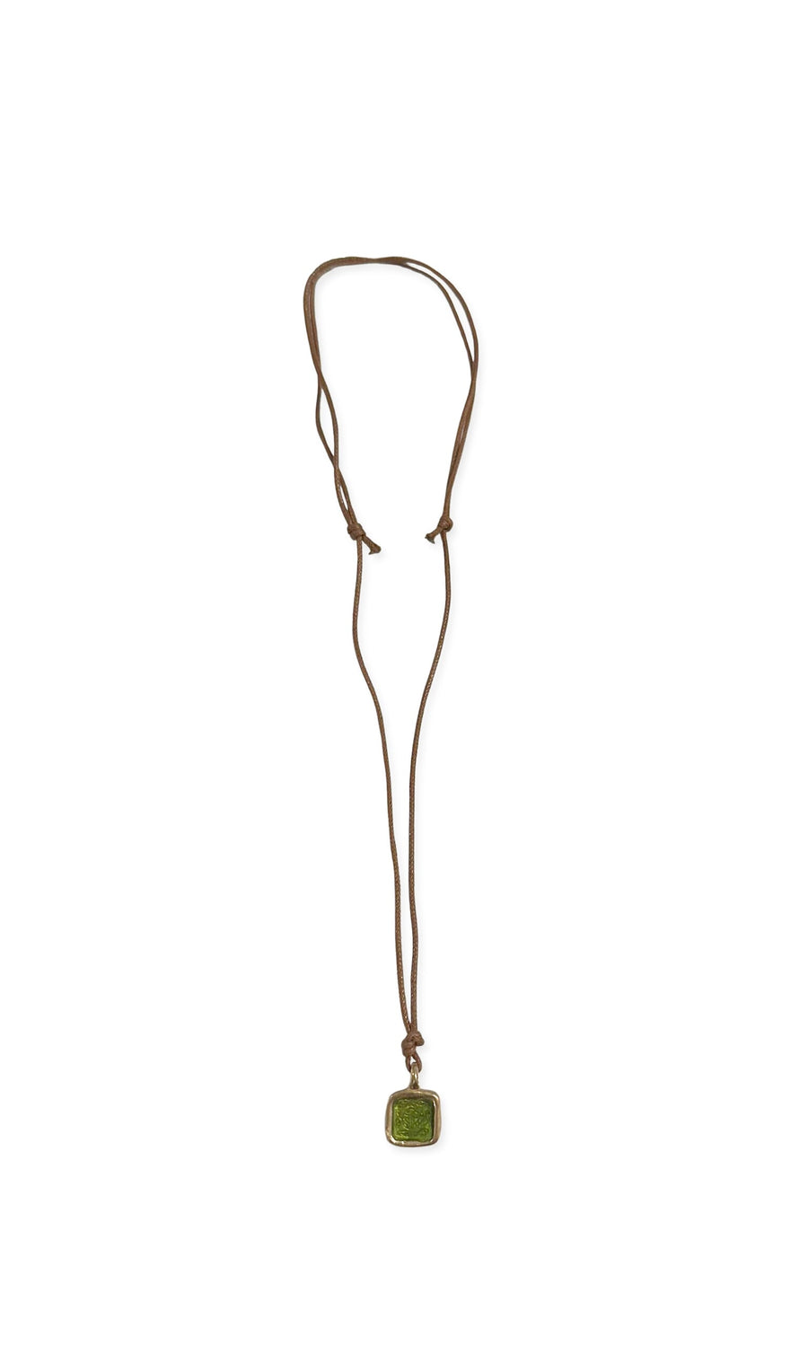 Plümo- The Nile Pendant is a brown cord necklace with an adjustable length and a square green glass pendant.