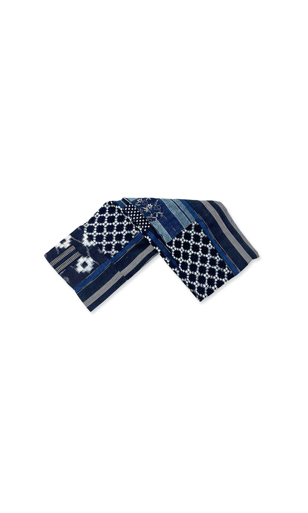 Plümo- The Indigo Patchwork Snood features blue and white geometric and floral designs, displayed folded on a white background.