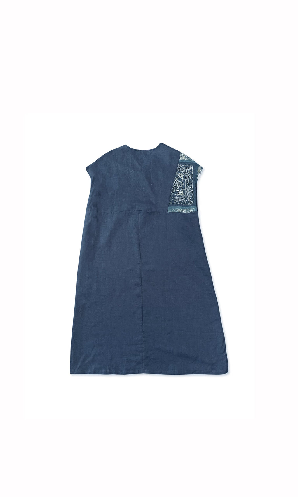 Plümo- Peace Dress in blue with an asymmetrical patterned patch on the upper right shoulder, laid flat on white.