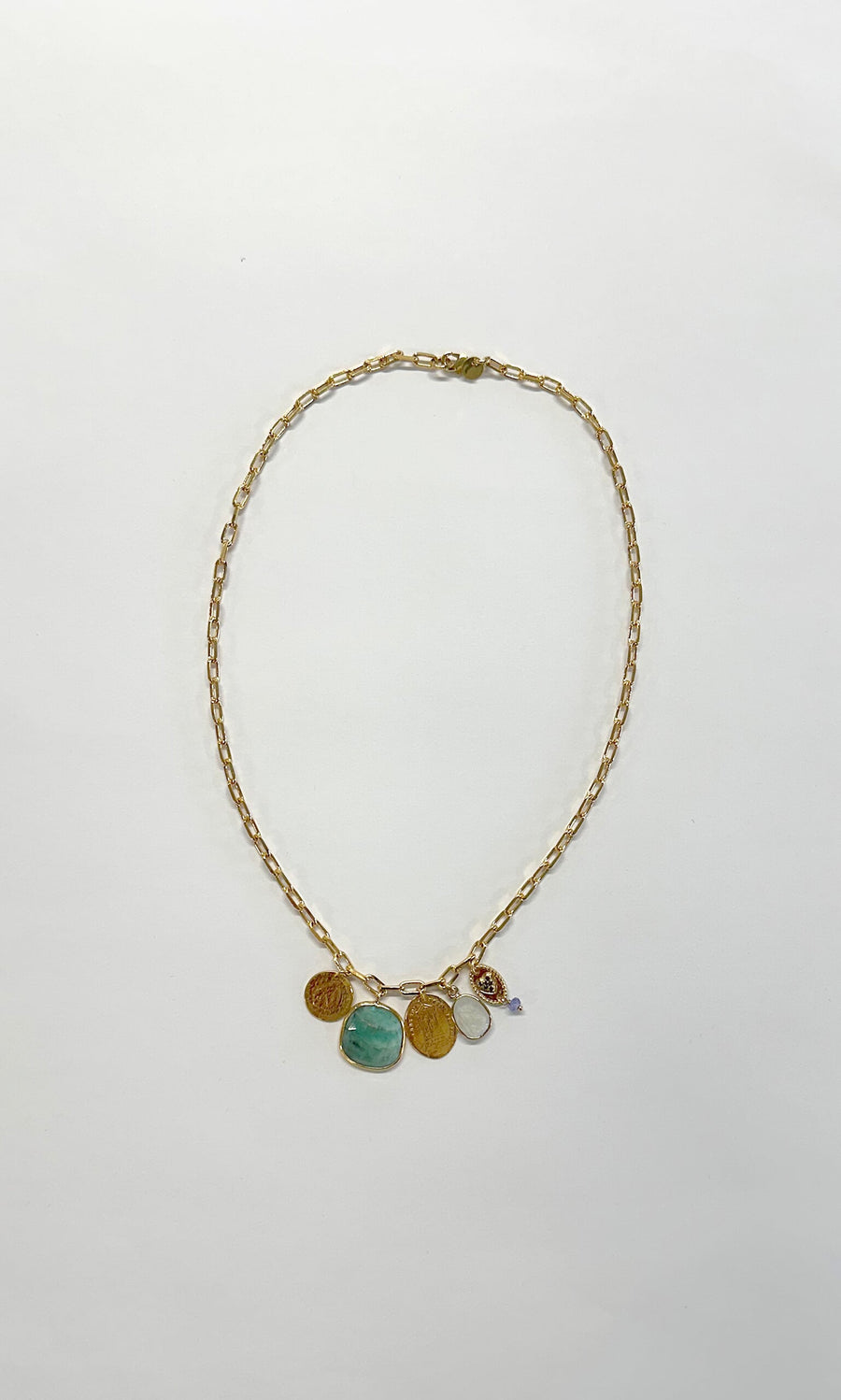 Plümo- Penny Stone Necklace: gold chain with five assorted penny pendants featuring gems, pearls, and turquoise.