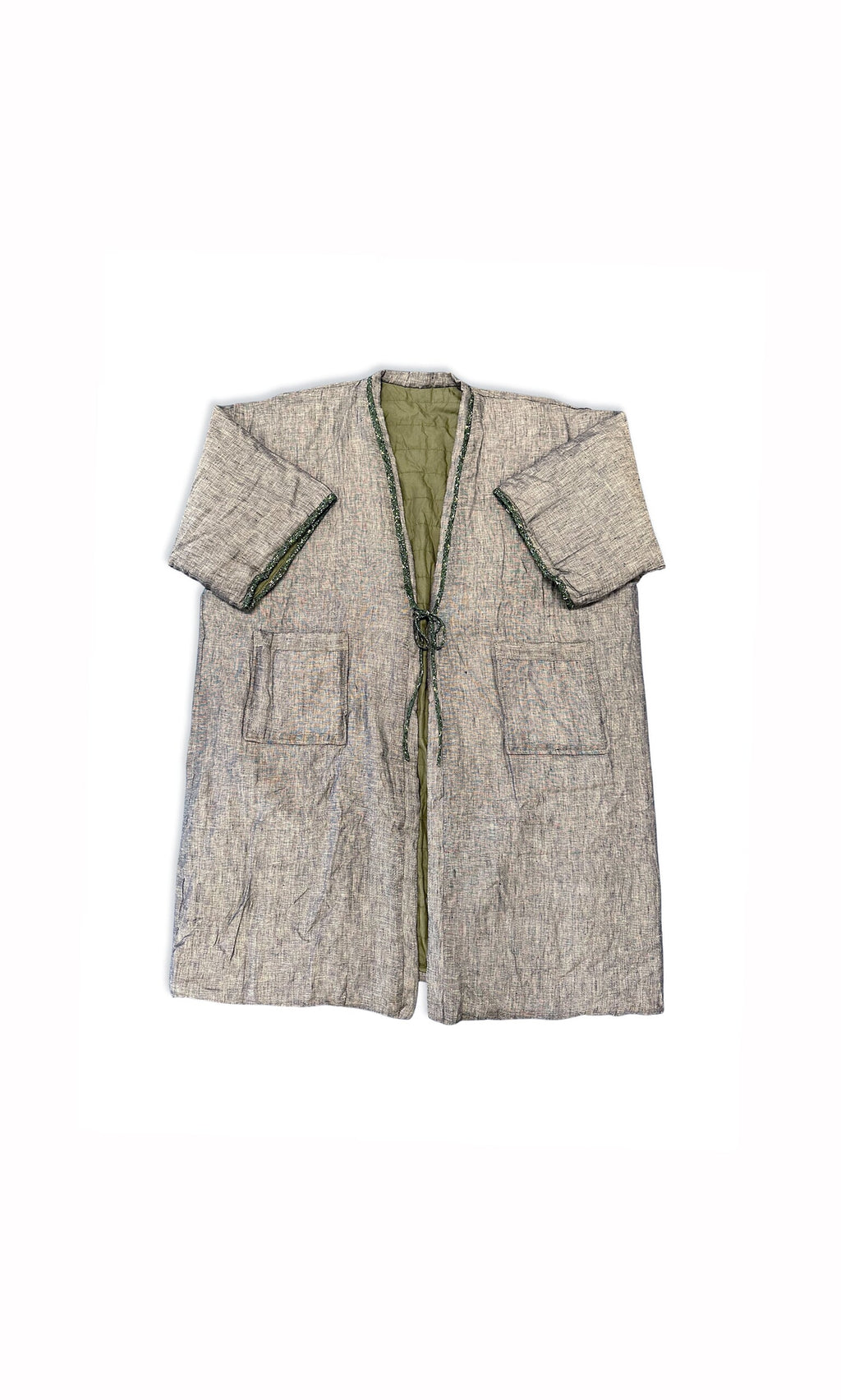 Plümo- The Akira Padded Coat is a gray, loose-fit, knee-length jacket with big front pockets and a green interior lining.
