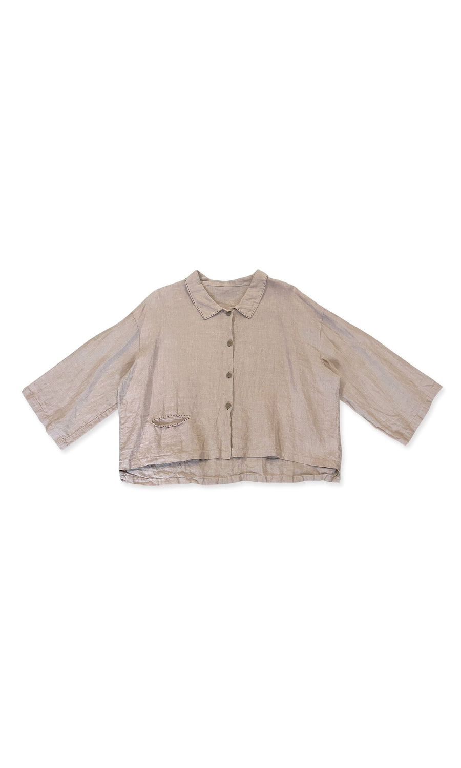 Plümo- The Sable Shirt is a light beige linen, relaxed fit with long sleeves, a small collar, and a left chest pocket.