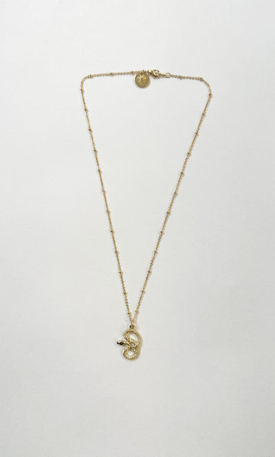 Plümo- The Serpent Necklace is a British-made gold plated necklace with a delicate chain and small snake pendant.