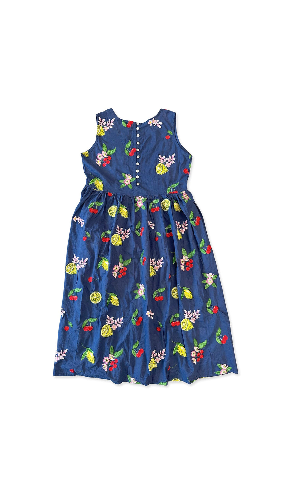 Plümo- The Talia Dress is a sleeveless navy cotton dress with floral embroidery, fruit details, and back bodice buttons.