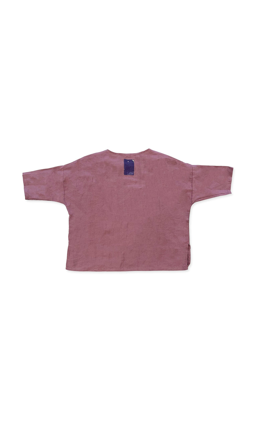 Plümo- The Thora Top, a boxy-fit mauve linen long-sleeve shirt, lays flat with a blue tag on the back neck.