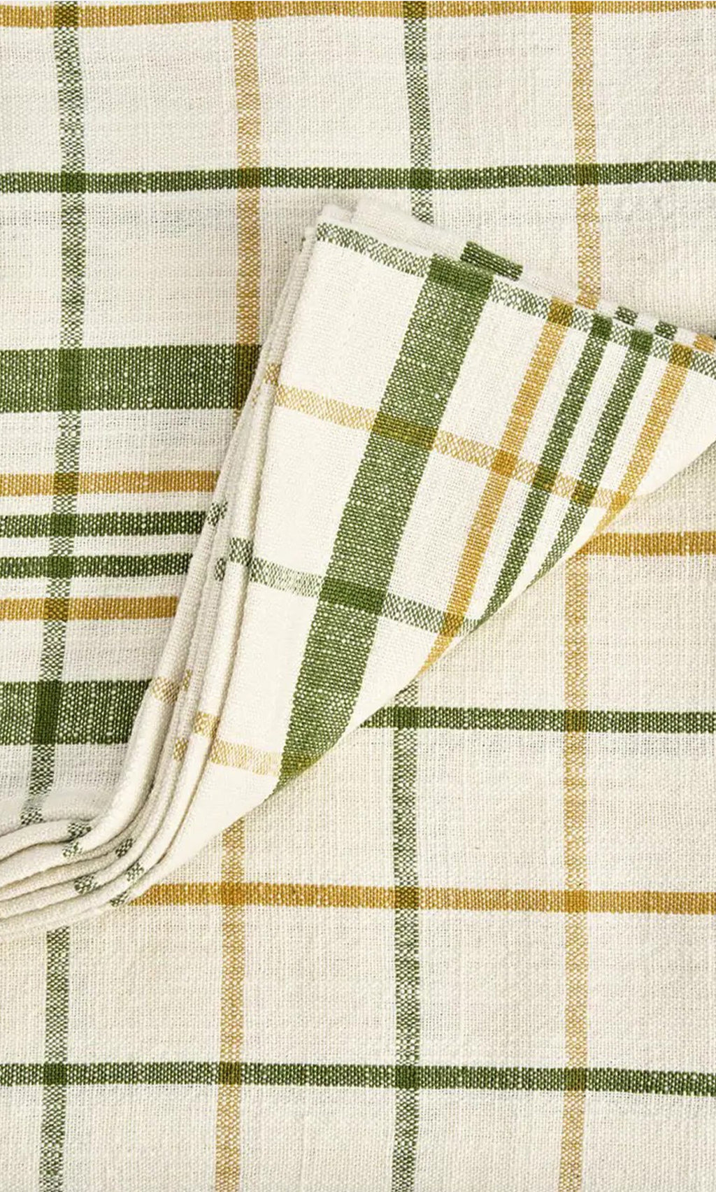 Plümo- The Farmhouse Table Cloth is cream-colored cotton with green and yellow checks on a matching plaid background.