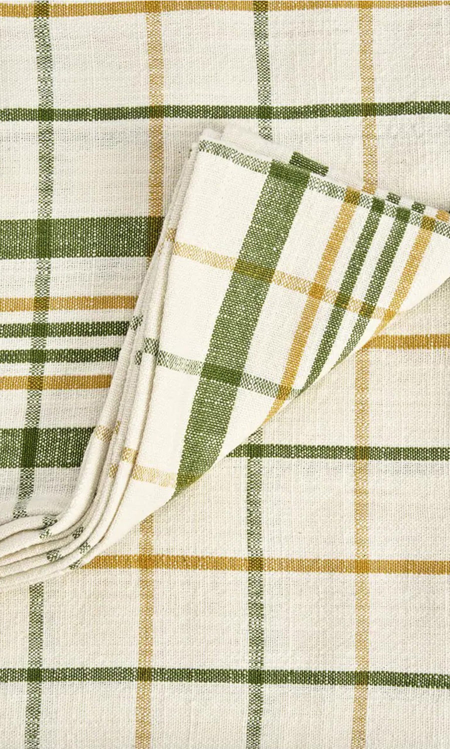 Plümo- The Farmhouse Table Cloth is cream-colored cotton with green and yellow checks on a matching plaid background.